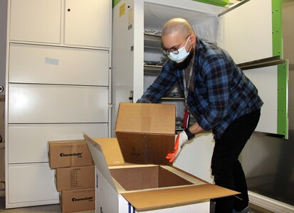 Robby Rosa, a logistics specialist for the U.S. Army Medical Materiel Agency’s Distribution Operations Center, or DOC, packs COVID-19 vaccine into special freezer boxes for shipment Jan. 26 at Fort Detrick, Maryland. The DOC works closely with the Department of Health and Human Services and Defense Health Agency to distribute vaccines and COVID-19 therapeutics around the globe to protect the operational force.