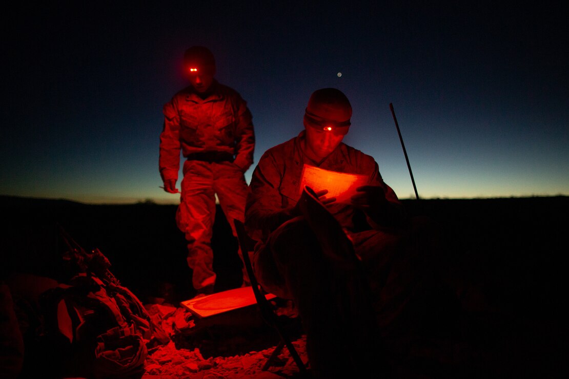 U.S. Marine Corps Lance Cpl. Dylan Neylon (right), a 60mm mortar section leader with Lima Company, 3rd Battalion, 7th Marine Regiment, 1st Marine Division, stands by for a fire mission during their Marine Corps Combat Readiness Evaluation at Marine Corps Air Ground Combat Center Twentynine Palms, Calif., Jan. 24, 2022. Range 400 employs realistic live fire training that produces combat-ready forces in preparation for Marine Rotational Force-Darwin 22.2.