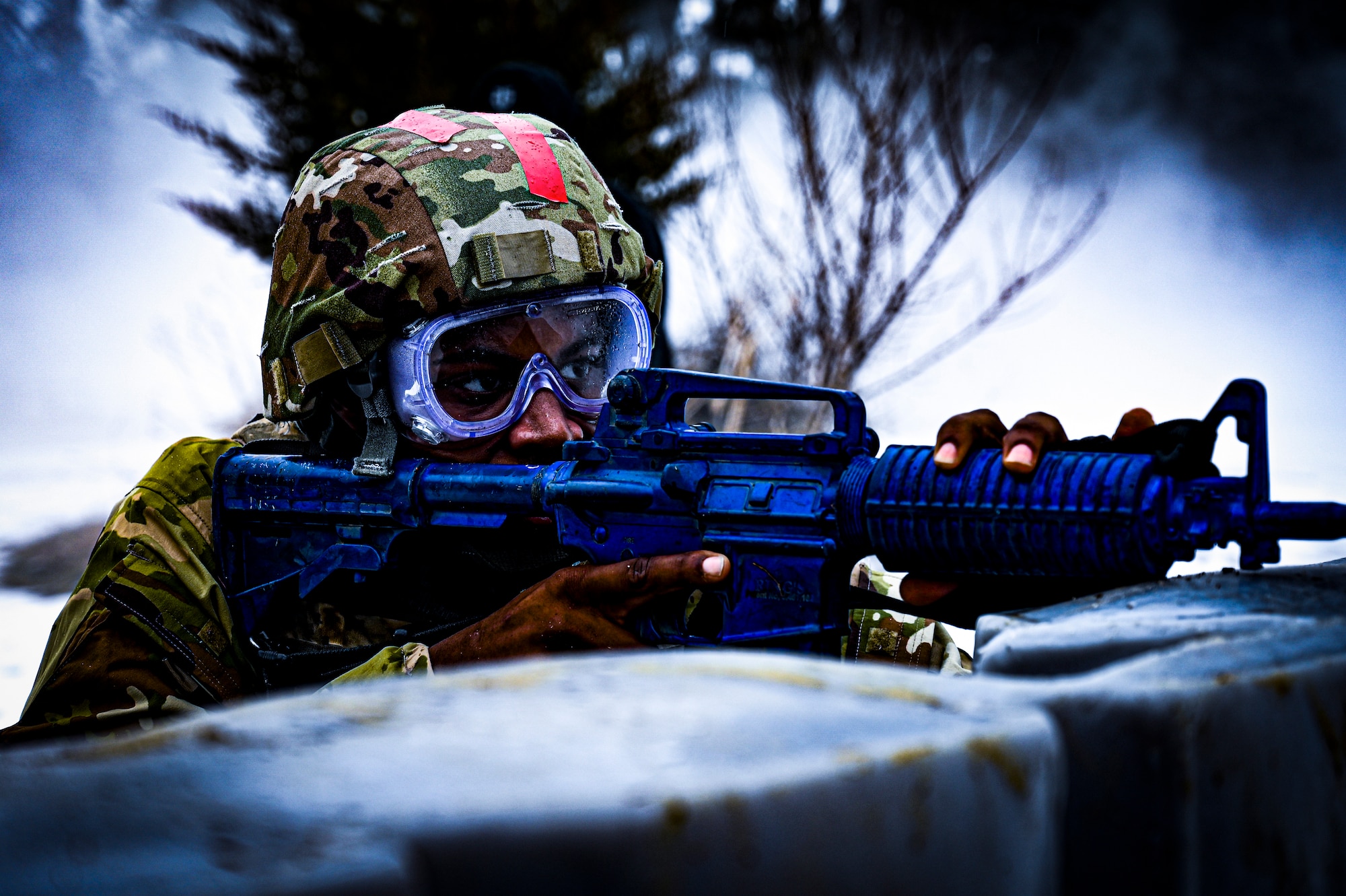 A U.S. Army Soldier, Army Support Activity Dix, provides perimeter security with a non-functional training weapon at the Medical Simulation Training Center (MSTC) on Feb. 3, 2022, at Joint Base McGuire-Dix-Lakehurst, N.J. The MSTC provides state of the art training in treating all areas of trauma and basic medical scenarios. Under the principles of Tactical Casualty Combat Care (TC3), students gain knowledge and skills to treat severe bleeding, manage a tension pneumothorax, and establish a secure airway. The MSTC offers TC3 training through classroom instruction, basic hands-on training, and the use of realistic trauma and medical scenarios. The functional skills developed are supported and reinforced by a final simulated battlefield exercise. This immersive environment helps to familiarize the student with potential environments found in deployed environments.