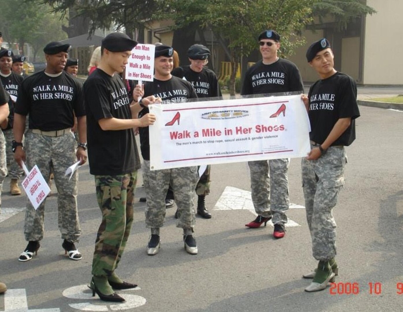 Adam Morrison participating in the Walk a Mile in Her Shoes