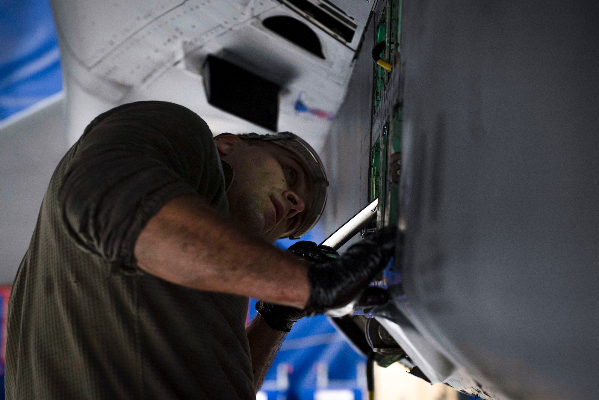 Staff Sgt. Matthew Carpenter, 334th Fighter Generation Squadron dedicated crew chief, inspects a utility accessor manifold at Seymour Johnson Air Force Base, North Carolina, Jan. 18, 2022. The 334th FGS stands ready to deploy and conduct sustained combat operations on a no-notice basis, worldwide. (U.S. Air Force photo by Airman 1st Class Sabrina Fuller)