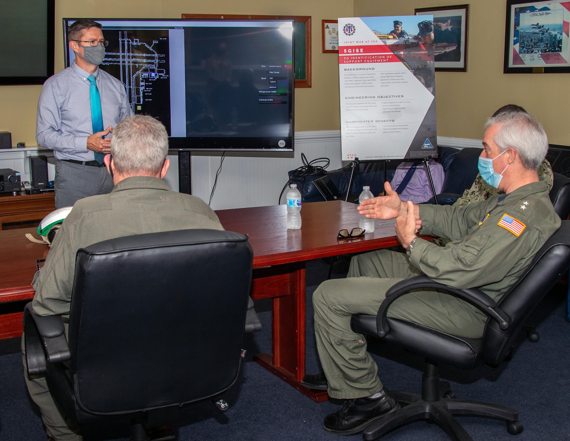 Rear Adm. John Meier, commander of Naval Air Force Atlantic, participates in an Advanced Naval Technology Exercise at Naval Air Station Oceana where engineers from the Naval Air Warfare Center Aircraft Division demonstrated a next-generation flight line tracking system. The 5G Identification of Support Equipment (5GISE) system tracks flight line assets like fuel trucks, tow tractors, and other support equipment in real-time on mobile devices via GPS to improve situational awareness and efficiency for naval aviation operations. (U.S. Navy photo)