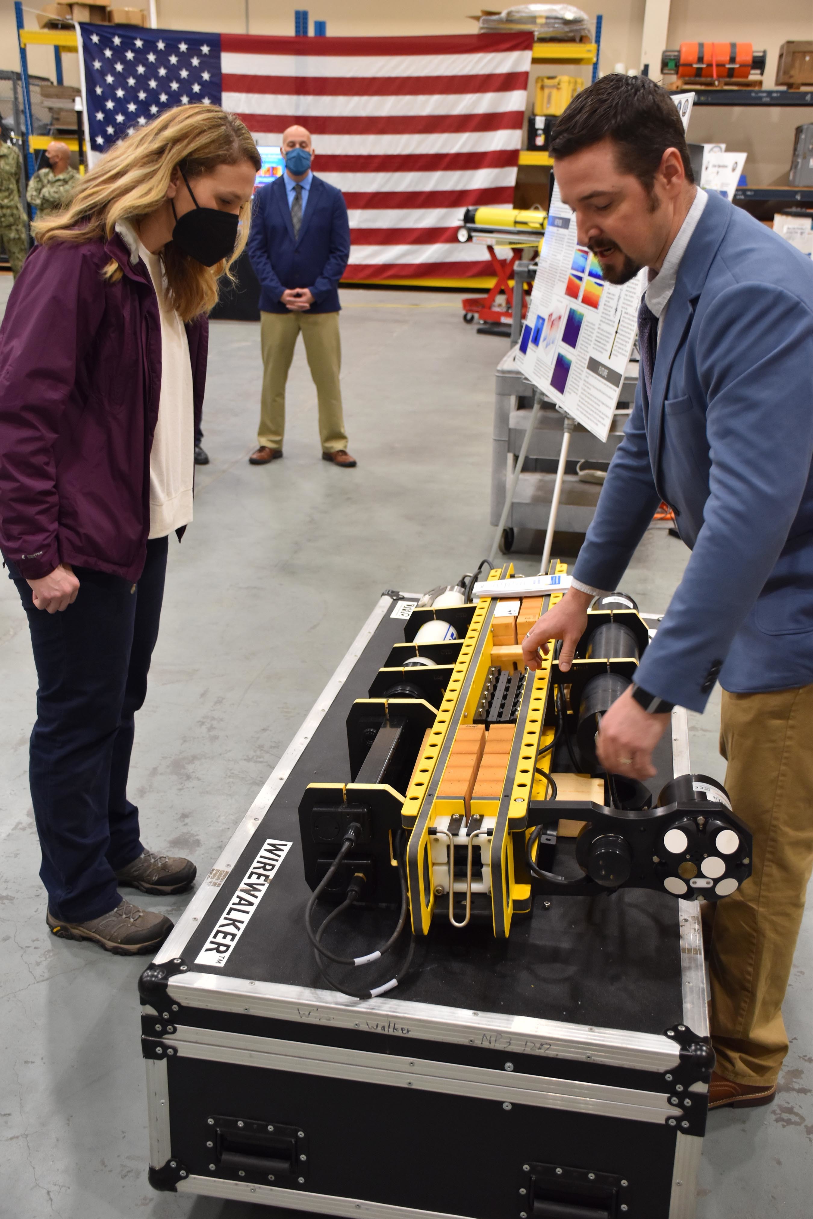 The Honorable Meredith Berger, Assistant Secretary of the Navy for Energy, Installations and Environment and performing the duties of the Under Secretary of the Navy is briefed by Raymond Pluhar, Naval Oceanographic Office oceanographer, on Fleet Survey Team capabilities in the oceanographic high bay of FST during her first visit to Naval Oceanography and Meteorology Command (NMOC) at NASA Stennis Space Center, Mississippi, Feb. 3, 2022. Naval Meteorology and Oceanography Command directs and oversees more than 2,500 globally-distributed military and civilian personnel who collect, process and exploit environmental information to assist Fleet and Joint Commanders in all warfare areas to make better decisions faster than the adversary.