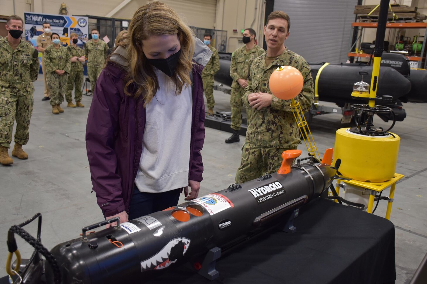 The Honorable Meredith Berger, Assistant Secretary of the Navy for Energy, Installations and Environment and performing the duties of the Under Secretary of the Navy is briefed on Fleet Survey Team capabilities in the oceanographic high bay of FST during her first visit to Naval Oceanography and Meteorology Command (NMOC) at NASA Stennis Space Center, Mississippi, Feb. 3, 2022. Naval Meteorology and Oceanography Command directs and oversees more than 2,500 globally-distributed military and civilian personnel who collect, process and exploit environmental information to assist Fleet and Joint Commanders in all warfare areas to make better decisions faster than the adversary.