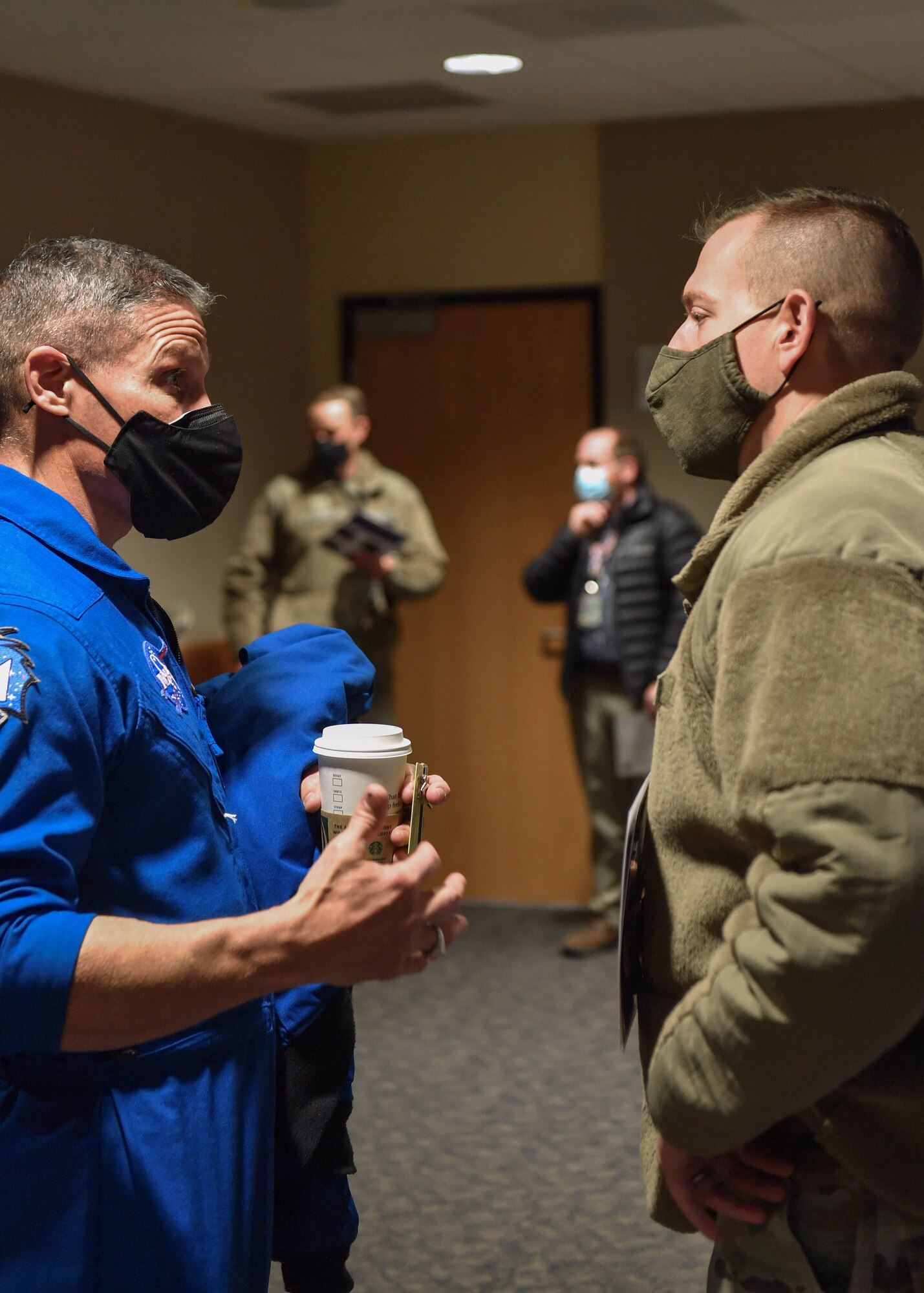 U.S. Space Force Col. Mike S. Hopkins, NASA astronaut, spoke with Airmen and Guardians during his visit to Schriever Space Force Base, Colorado, Jan. 27, 2022. During the Q&A session, Hopkins discussed life in space and his career as an Airman, Guardian and Astronaut. (U.S. Space Force photo by Tiana Williams)