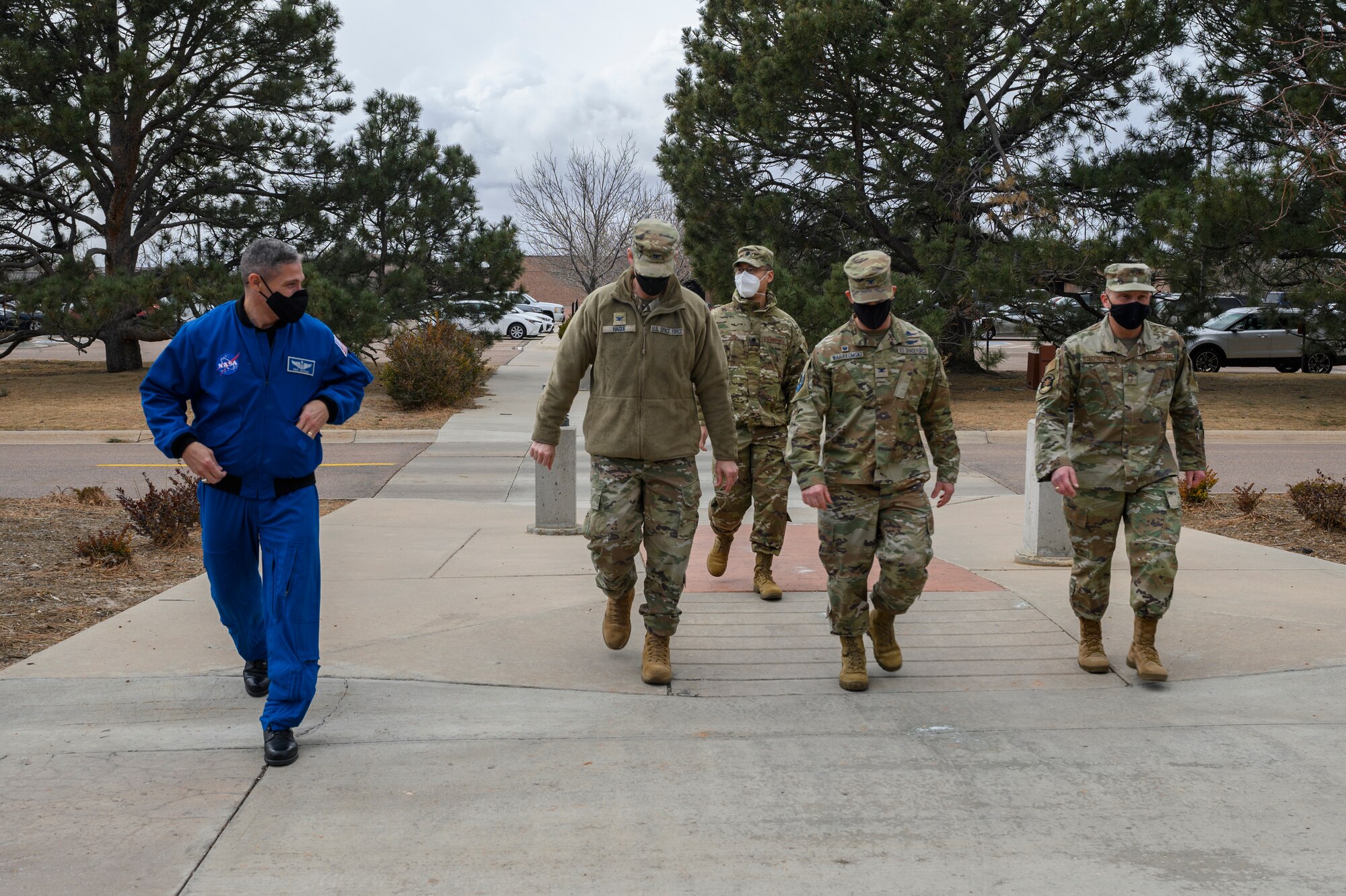 (Left to right) U.S. Space Force Col. Mike Hopkins, NASA astronaut, and U.S. Space Force Col. Nick Hague, USSF Test and Evaluation director, meet with U.S. Space Force Col. Shay Warakomski, Peterson-Schriever Garrison commander, and U.S. Air Force Chief Master Sgt. Daniel Stellabotte, 21st Medical Group superintendent, prior to a Q&A session at the Peterson Space Force Base Hub, Colorado, Jan. 25, 2022. Hopkins spent two days connecting with Guardians, Airmen, families, and civilians at Peterson SFB and Schriever SFB, sharing stories from his two space missions. (U.S. Space Force photo by Paul Honnick)