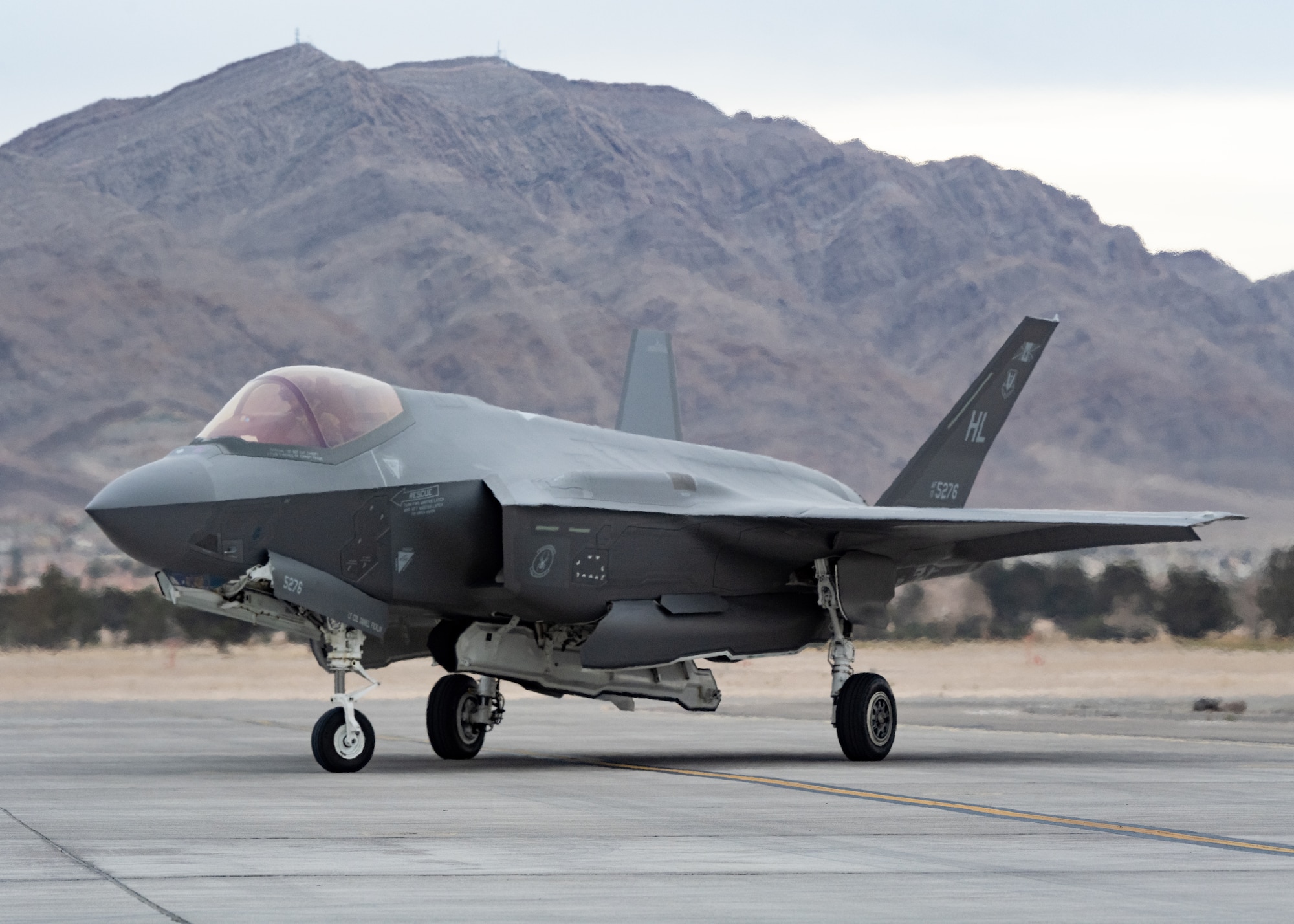 a photo of an F-35 pilot saluting a crew chief