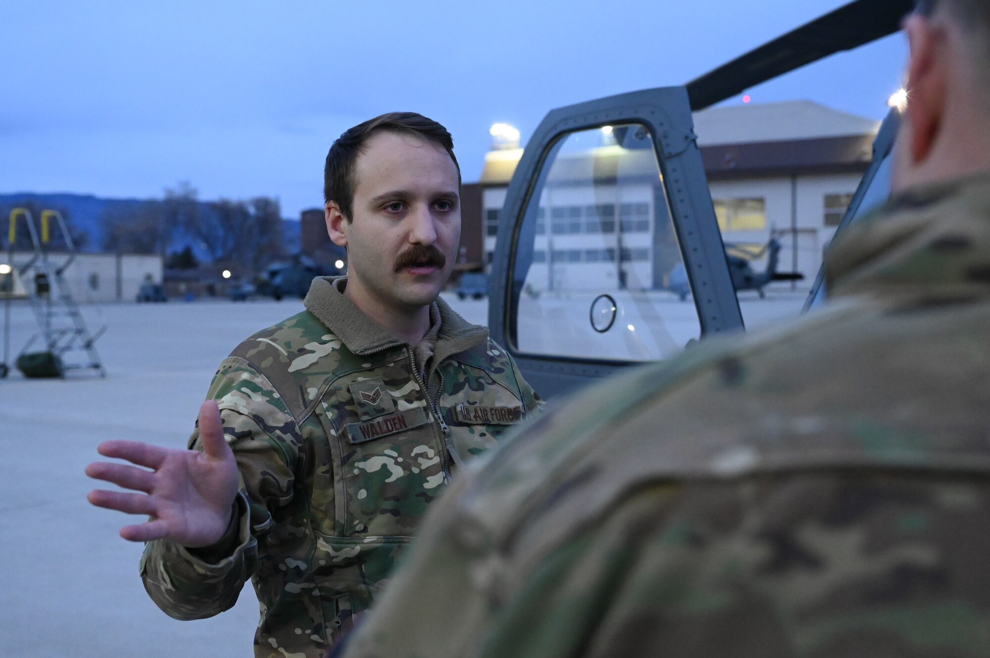 A man makes hand gestures.