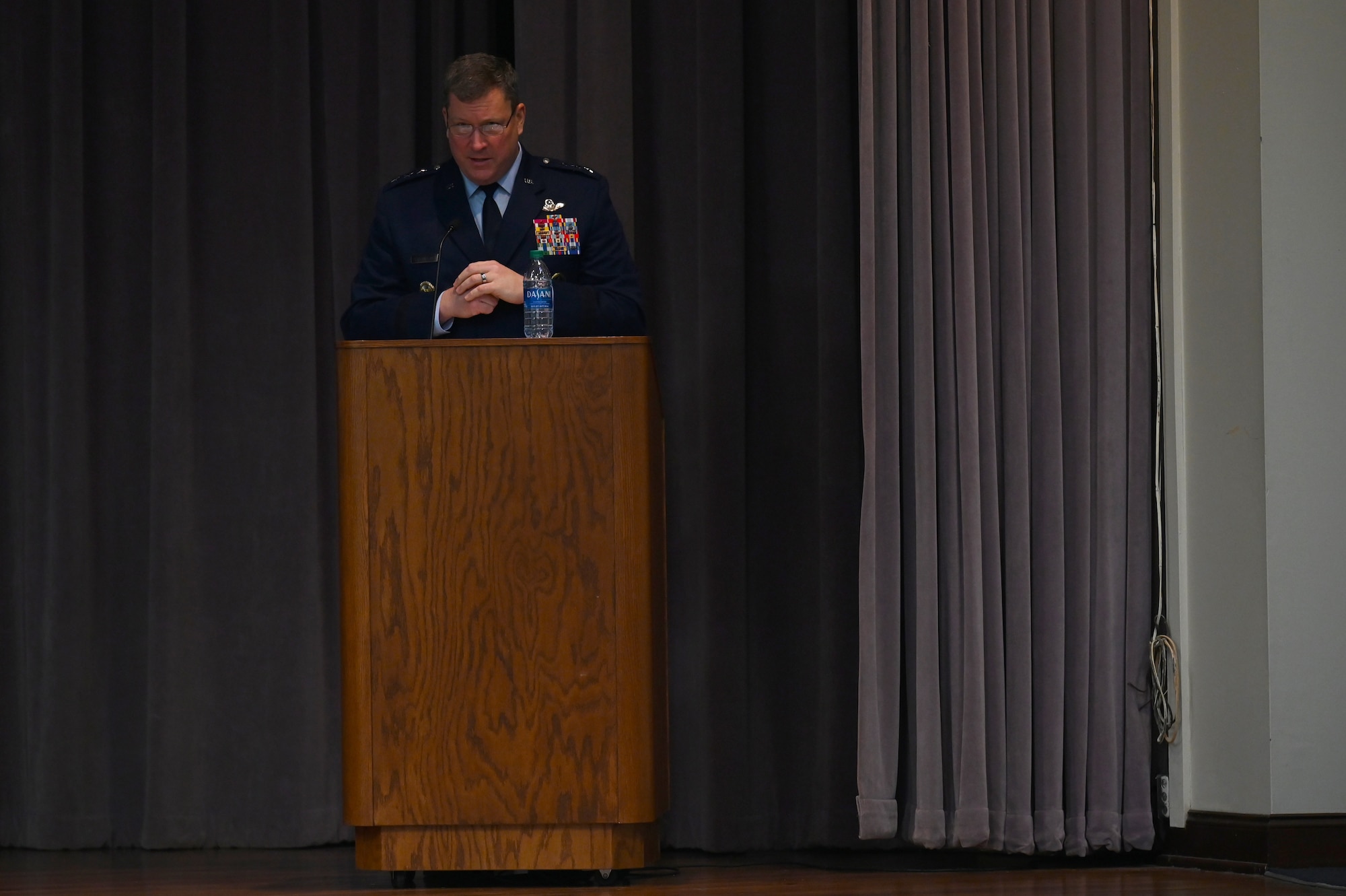 USAF Lt. Gen. Tony Bauernfeind, Headquarters U.S. Special Operations Command vice commander, speaks to the graduates of Specialized Undergraduate Pilot Training class 22-05 Feb 4, 2022, on Columbus Air Force Base, Miss. Bauernfeind earned his commission from the U.S. Air Force Academy in 1991 and has flown more than 3,500 hours in the MC-130E, MC-130H and MQ-9 aircraft. (U.S. Air Force photo by Senior Airman Jake Jacobsen)