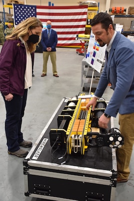 The Honorable Meredith Berger, Assistant Secretary of the Navy for Energy, Installations and Environment and performing the duties of the Under Secretary of the Navy is briefed by Raymond Pluhar, Naval Oceanographic Office oceanographer, on Fleet Survey Team capabilities in the oceanographic high bay of FST during her first visit to Naval Oceanography and Meteorology Command (NMOC) at NASA Stennis Space Center, Mississippi, Feb. 3, 2022. Naval Meteorology and Oceanography Command directs and oversees more than 2,500 globally-distributed military and civilian personnel who collect, process and exploit environmental information to assist Fleet and Joint Commanders in all warfare areas to make better decisions faster than the adversary.