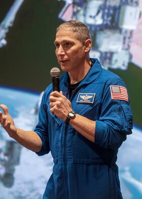 U.S. Space Force Col. Mike Hopkins, NASA astronaut, reminisces about a space selfie he captured while performing a spacewalk outside of the International Space Station during a presentation at Peterson Space Force Base, Colorado, Jan. 25, 2022. Hopkins, who most recently commanded Crew-1 SpaceX Crew Dragon and served as flight engineer for Expedition 64 to the ISS, shared stories from his two missions to the ISS. (U.S. Space Force photo by Paul Honnick)