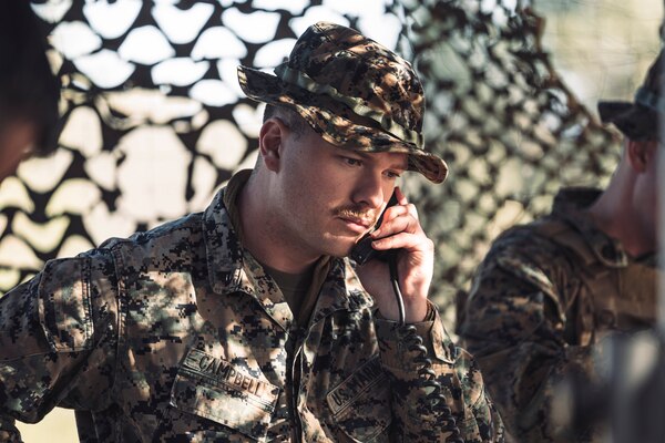 A Marine talks on a phone.