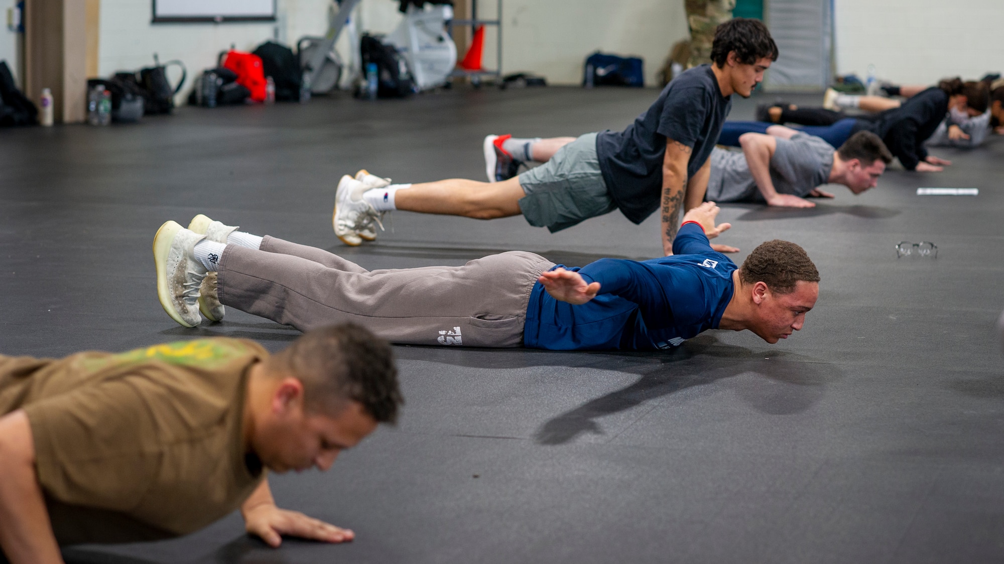 Trainees with the 514th Air Mobility Wing Development and Training Flight, Joint Base McGuire-Dix-Lakehurst, N.J., were able to familiarize themselves with the new alternate Air Force Physical Fitness Assessment components during a mock exam Feb. 5, 2022. The new components include a 20 meter high aerobic multi-shuttle run for the cardio portion, hand release push-ups for the strength portion, and either cross-leg reverse crunches or a plank for the sit-up portion.