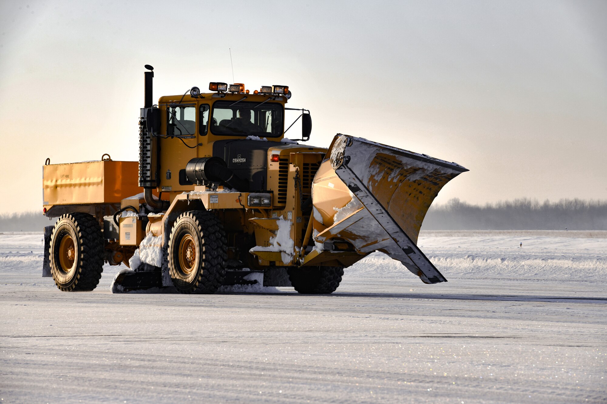 Civilian contractors with Youngstown Air Reserve
Station use specialized equipment to remove snow from the flightline on Feb. 5, 2022, at YARS.