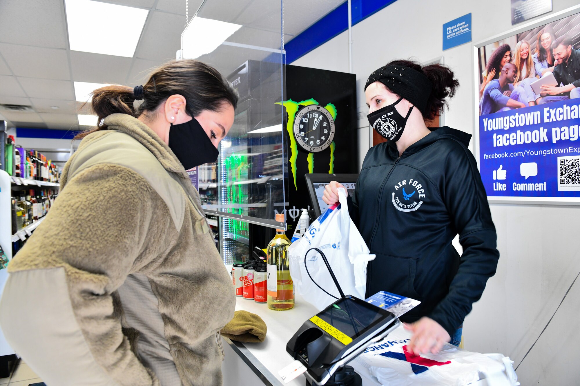 Liv Dye, a shift leader at the base exchange at Youngstown Air Reserve Station rings up Staff Sgt. Christiana Russo, a public affairs specialist assigned to the 910th Airlift Wing, Feb. 6, 2022, at YARS.