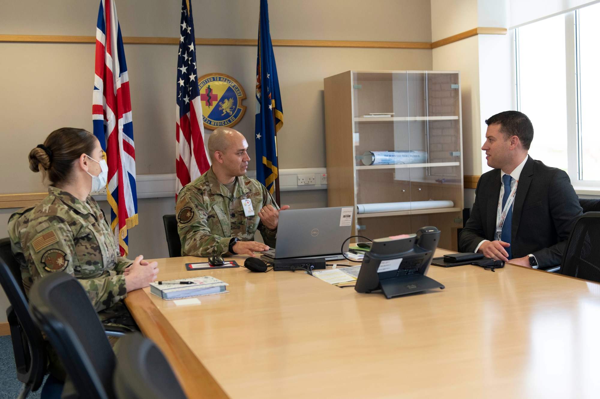 U.S. Air Force Lt. Col. Darrell Lee, center, 423rd Medical Squadron commander, and Master Sgt. Leslie Bush, left, 423rd MDS senior enlisted leader, brief Daryl Brown MBE DL, right, Deputy Lieutenant of Cambridgeshire, and Chief Executive of (Mid-Anglia General Practitioner Accident Service) Magpas Air Ambulance, about the medical squadron at Royal Air Force Alconbury, England. Brown is an incoming Honorary Commander for the 423rd MDS. (U.S. Air Force photo by Senior Airman Jennifer Zima)