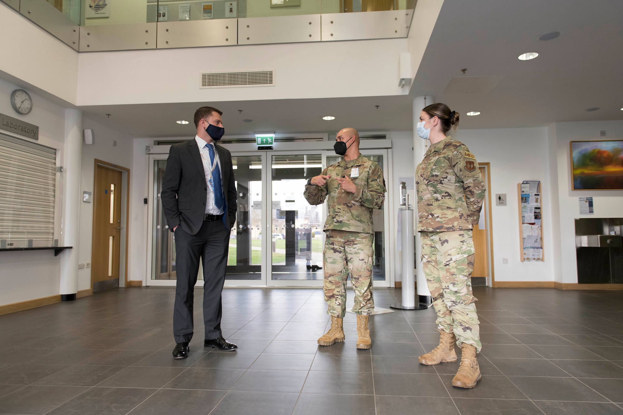 U.S. Air Force Lt. Col. Darrell Lee, center, 423rd Medical Squadron commander, and Master Sgt. Leslie Bush, right, 423rd MDS senior enlisted leader, brief Daryl Brown MBE DL, left, Deputy Lieutenant of Cambridgeshire, and Chief Executive of (Mid-Anglia General Practitioner Accident Service) Magpas Air Ambulance, about the medical squadron at Royal Air Force Alconbury, England. Brown is an incoming Honorary Commander for the 423rd MDS. (U.S. Air Force photo by Senior Airman Jennifer Zima)