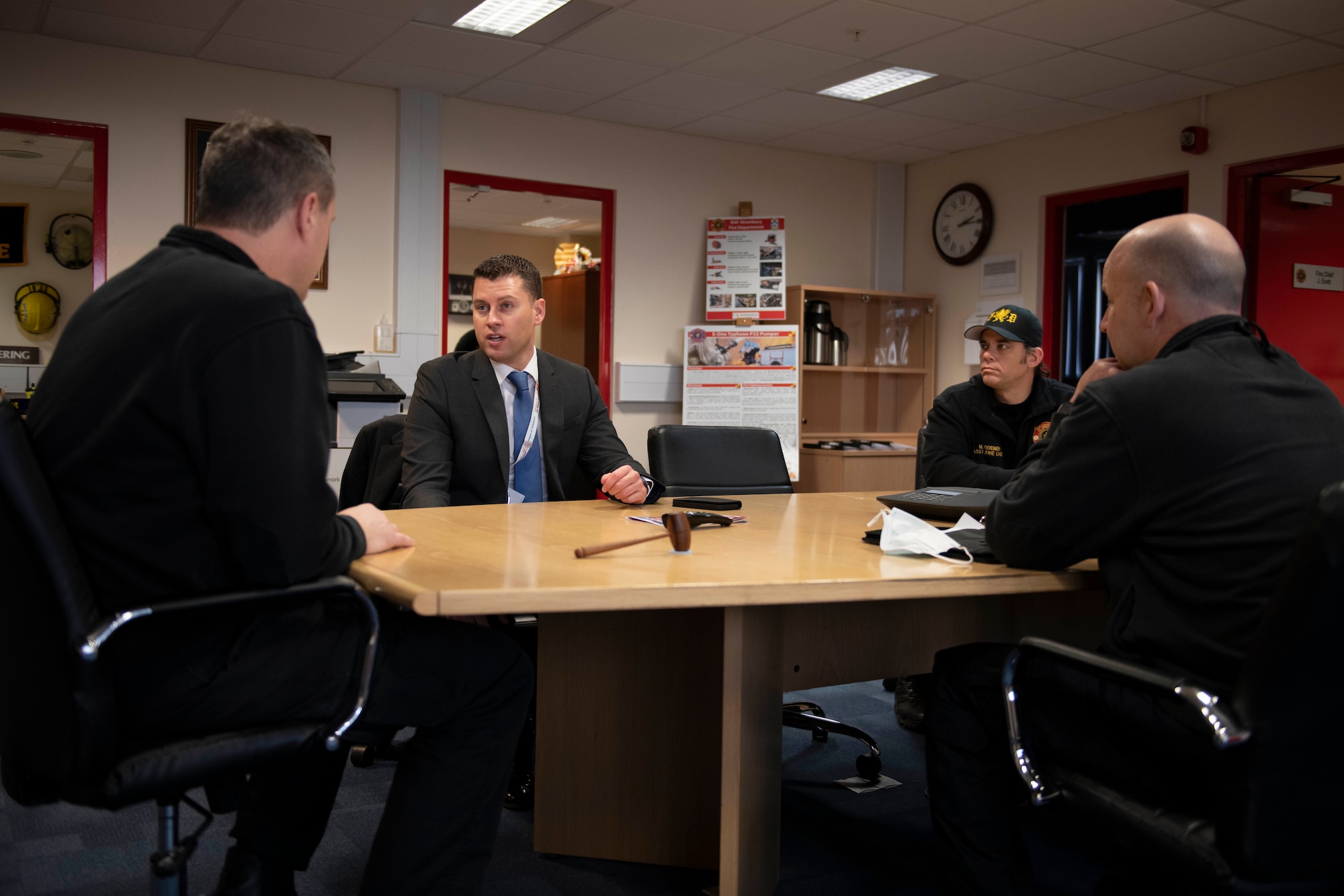 J. Evett, left, 423rd Civil Engineer Squadron fire chief, speaks with Daryl Brown MBE DL, center, Deputy Lieutenant of Cambridgeshire, and Chief Executive of (Mid-Anglia General Practitioner Accident Service) Magpas Air Ambulance, at the fire department at Royal Air Force Alconbury, England. Brown and Evett discussed creating joint medical training with the Magpas community and the 423rd CES firefighters. (U.S. Air Force photo by Senior Airman Jennifer Zima)
