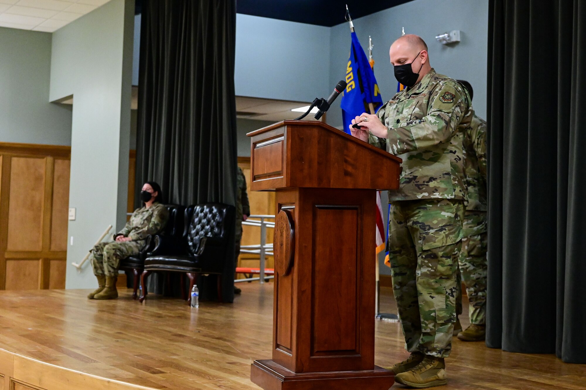 Lt. Col. Randolph Bosch, former 19th Medical Support Squadron commander, swaps his unit patch