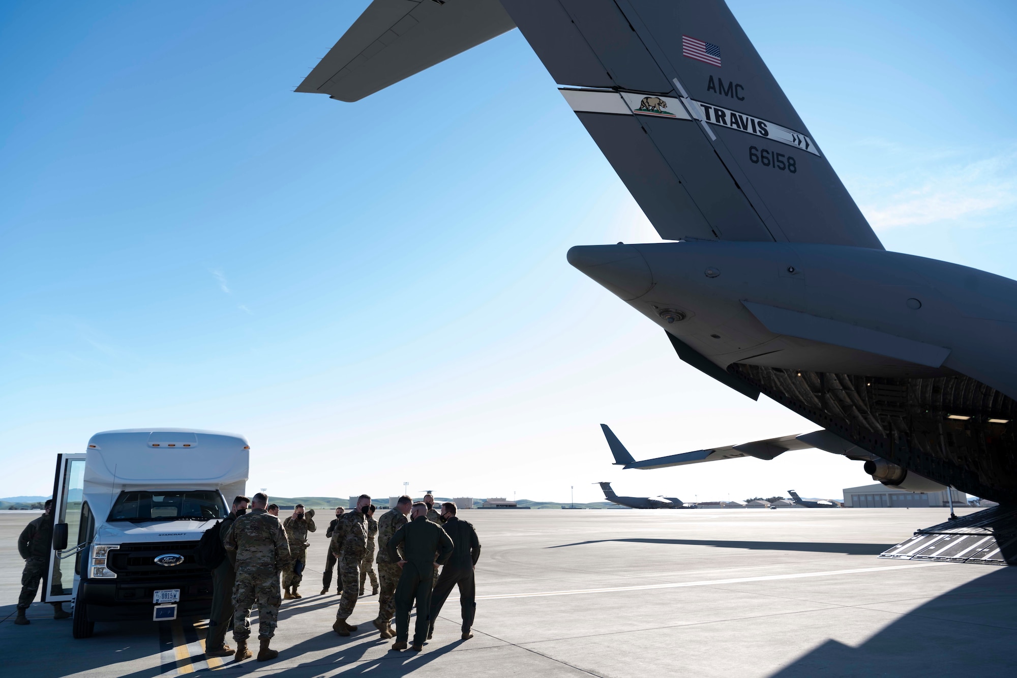 People walk towards a plane