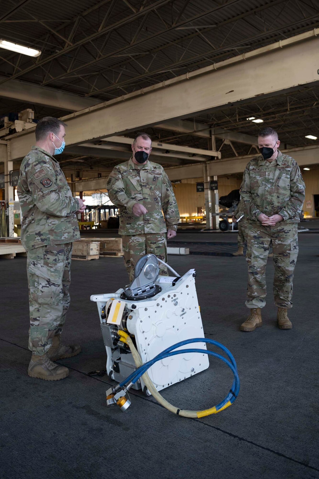 people discuss around a cargo winch