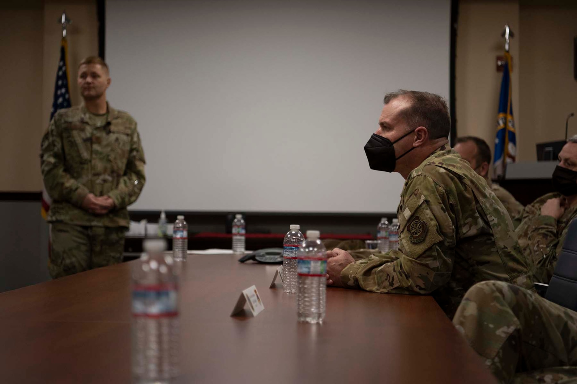 People sit at a table during a meeting