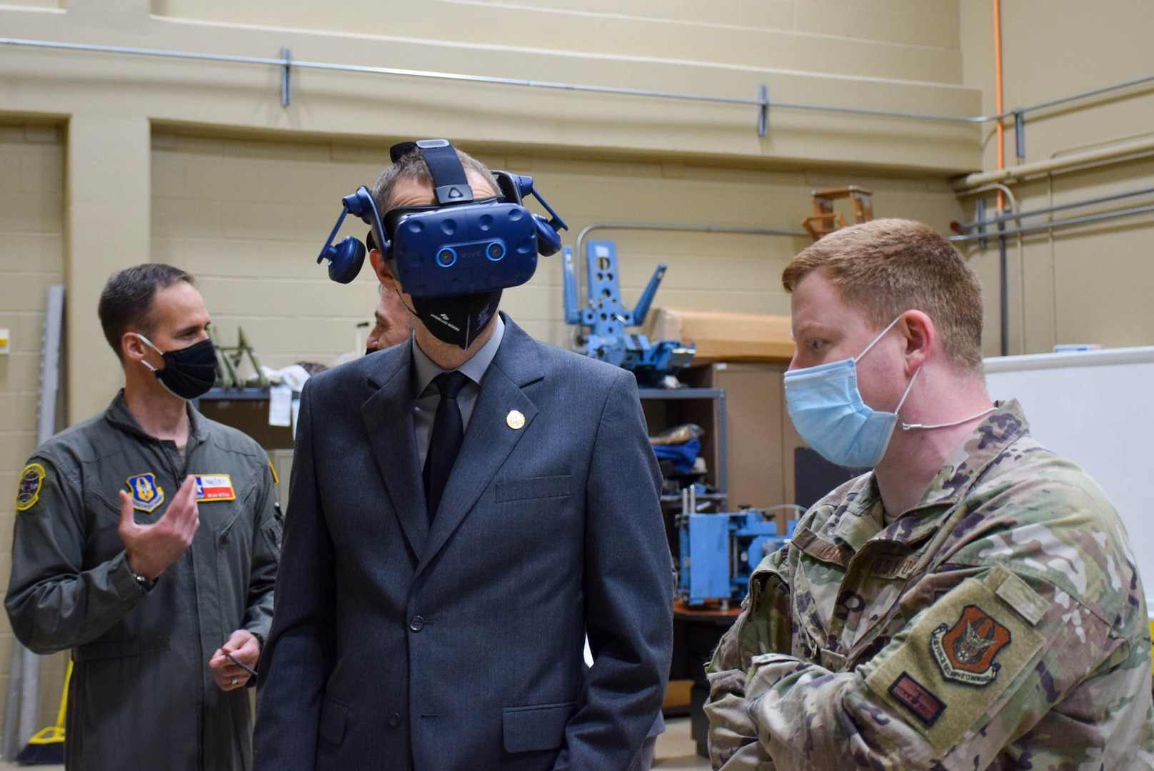Petr Zlatohlávek, Jagello 2000 Association senior project director, tests the virtual reality headset inside the virtual reality room Jan. 25, 2022, while Maj. Paul Lentz, 733rd Training Squadron director of operations, explains the functions and capabilities of the system, at Joint Base San Antonio-Lackland, Texas. Zlatohlávek was experiencing a virtual model of the C-5M Super Galaxy through the headset. (U.S. Air Force photo by Airman Mark Colmenares)