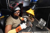 SPC Maurice Artis-Miller, form Baker Company 90th ASB Dallas, Texas works on her skills TIG welding on stainless steel while training at CCAD.