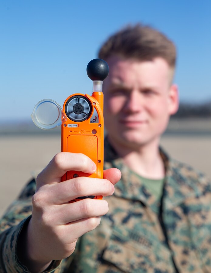 U.S. Marine Corps Lance Cpl. Chandler A. Hodge, a meteorology and oceanography (METOC) analyst forecaster with Marine Corps Air Facilities Quantico, reads information off a kestrel weather meter at Marine Corps Base Quantico, Virginia, Jan. 26, 2022. This device reads the wet bulb globe temperature, pressure, and humidity, and is used in tactical situations, or when the weather conditions need to be known on the spot. (US Marine Corps photo by Lance Cpl. Kayla LaMar)