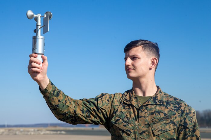 U.S. Marine Corps Cpl. Haydon R. King, a meteorology and oceanography (METOC) analyst forecaster with Marine Corps Air Facilities Quantico, reads the information off of an anemometer at Marine Corps Base Quantico, Virginia, Jan. 26, 2022. The anemometer is a weather instrument used to read both wind speed and direction. (US Marine Corps photo by Lance Cpl. Kayla LaMar)