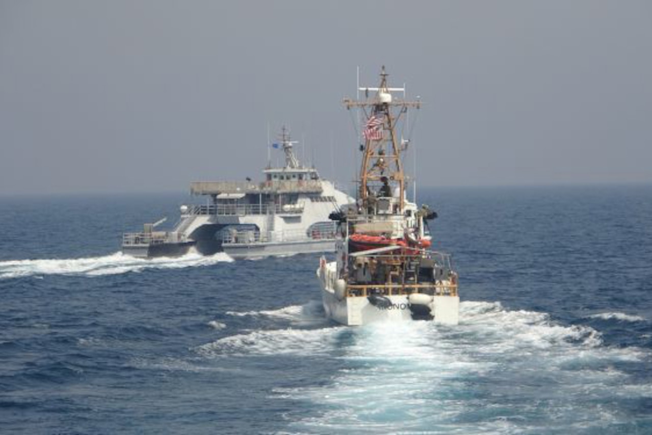 Boats float in sea.