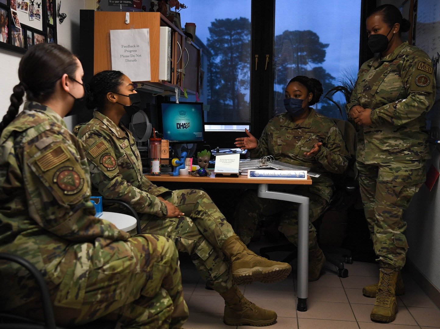 U.S. Air Force Tech. Sgt. Latasha Smith, 86th Operational Medical Readiness Squadron warrior medicine clinic flight chief, second from right, discusses her career field  training during a meeting at Ramstein Air Base, Germany, Feb. 1, 2022. Smith is in charge of a flight of 26 active duty members in whom she receives extreme satisfaction ensuring that they are fully taken care of and good to go by reviewing promotion evaluations, working on education records and helping them be better NCOs. (U.S. Air Force photo by Airman 1st Class Jared Lovett)