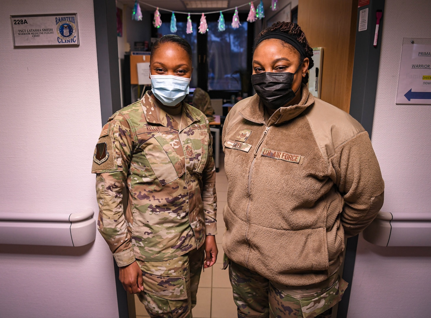 U.S. Air Force Tech. Sgt. Latasha Smith, 86th Operational Medical Readiness Squadron warrior medicine clinic flight chief, right, poses for a photo with Chief Master Sgt. Charmaine Kelley, 86th Airlift Wing command chief, left, at Ramstein Air Base, Germany, Jan. 27, 2022. Smith is responsible for streamlining the COVID-19 vaccine line, resulting in the inoculation of approximately 2,500 active duty service members, dependents and civilians, within the past 40 days. (U.S. Air Force photo by Airman 1st Class Jared Lovett)