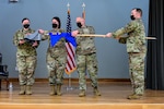 Col. Jennifer Bratz, 19th Medical Group commander, and Lt. Col. Randolph Bosch, former 19th Medical Support Squadron commander, right, case the furled 19th MDSS flag