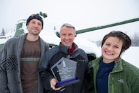 The Alaska Army National Guard's Restoration Team, Patrick Greary (left), Donald Flournoy, Alyssa Murphy and Aaron Acena (not pictured), received the Environmental Security Award from the National Guard Bureau for their accomplishments in environmental restoration for former AKNG properties. (U.S. Army National Guard photo by Victoria Granado)