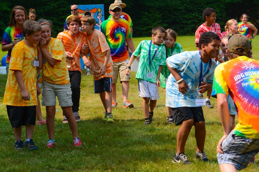 Children play at a camp site.