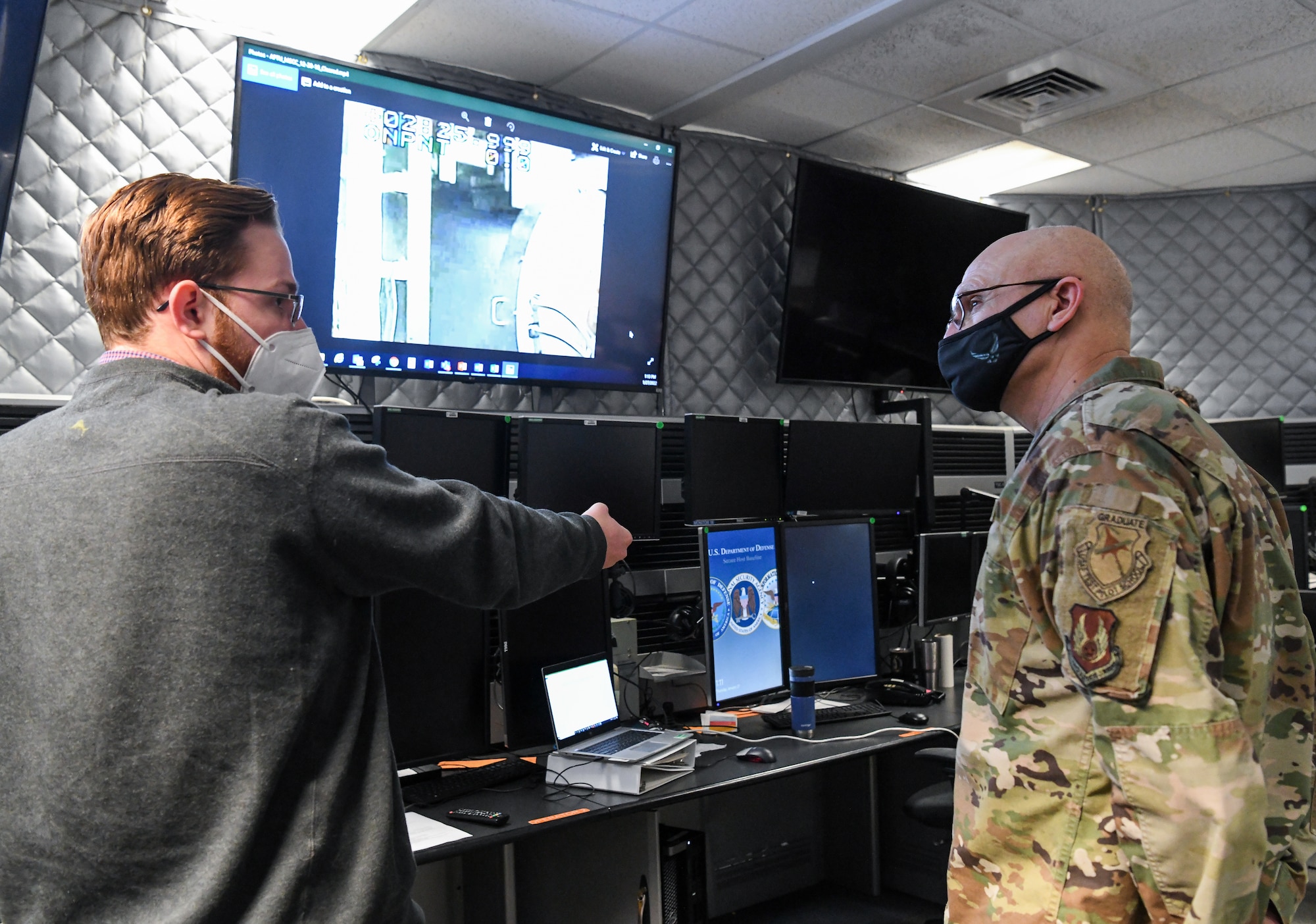 Jarrett Starbuck, a test analyst with the Hypersonic Systems Test Branch, Test Division, Arnold Engineering Development Complex (AEDC), speaks to Gen. Arnold W. Bunch Jr., commander, Air Force Materiel Command, about the Aerodynamic and Propulsion Test Unit at Arnold Air Force Base, Tenn., headquarters of AEDC, Jan. 27, 2022. (U.S. Air Force photo by Jill Pickett)