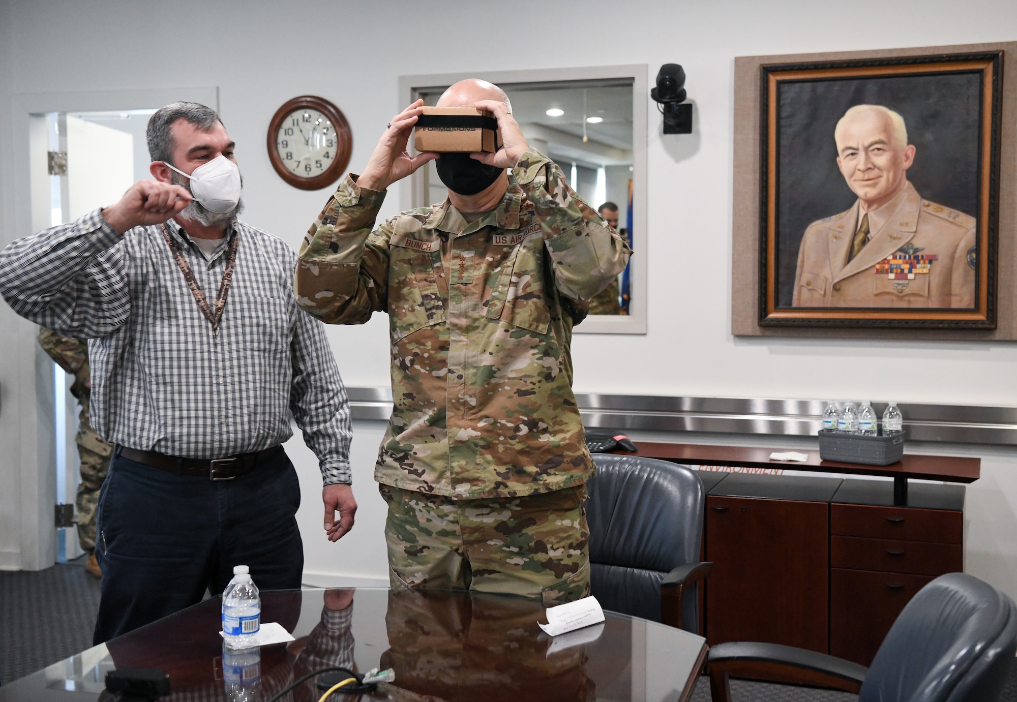 Jason Austin, chief, Arnold Engineering Development Complex (AEDC) Public Affairs, shows Gen. Arnold W. Bunch Jr., commander, Air Force Materiel Command, a virtual reality tour of AEDC facilities during the general's visit to Arnold Air Force Base, Tenn., headquarters of AEDC, Jan. 27, 2022. The virtual reality tours are being explored as a public affairs tool. (U.S. Air Force photo by Jill Pickett)