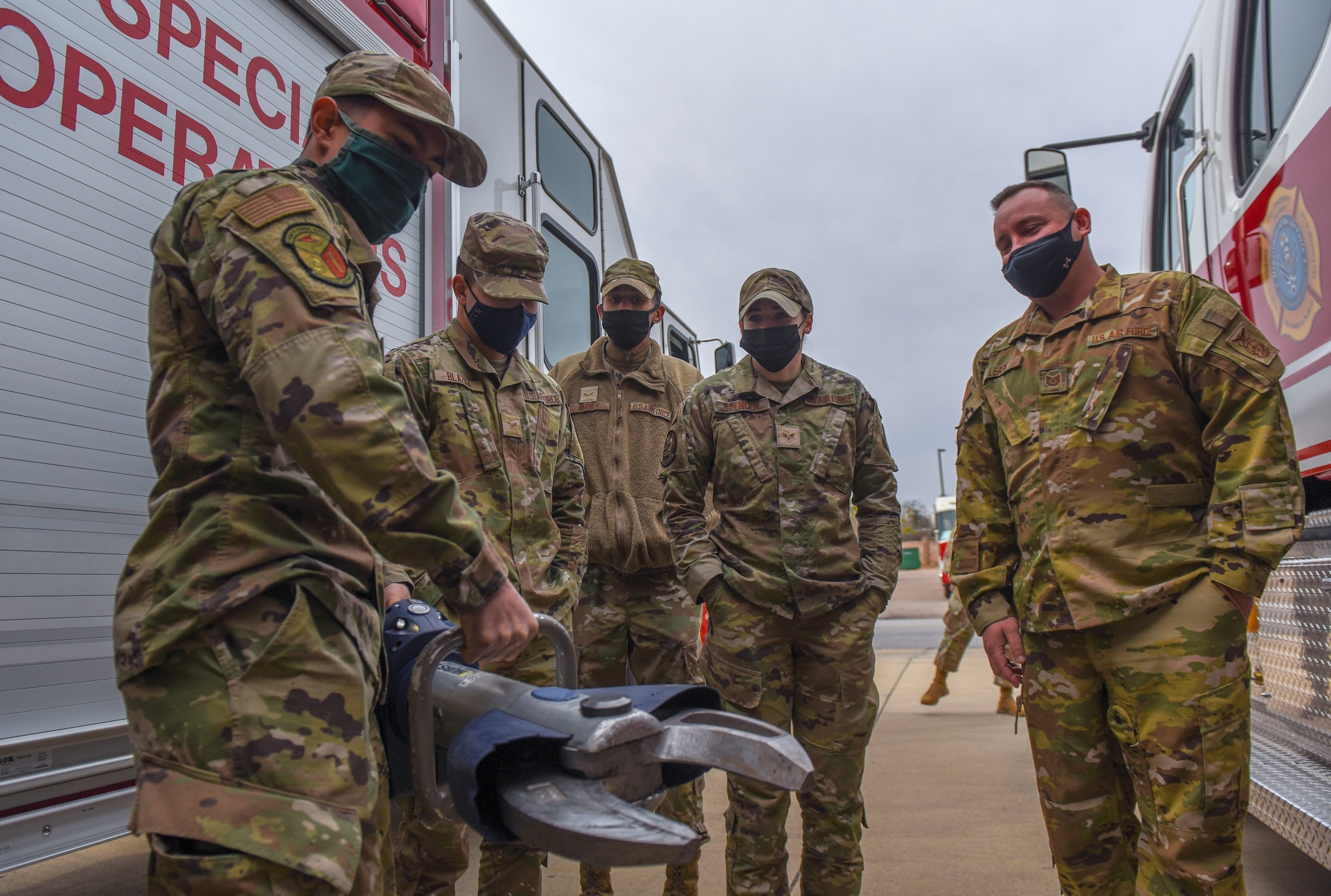 A group of Airmen participate in a demonstration.