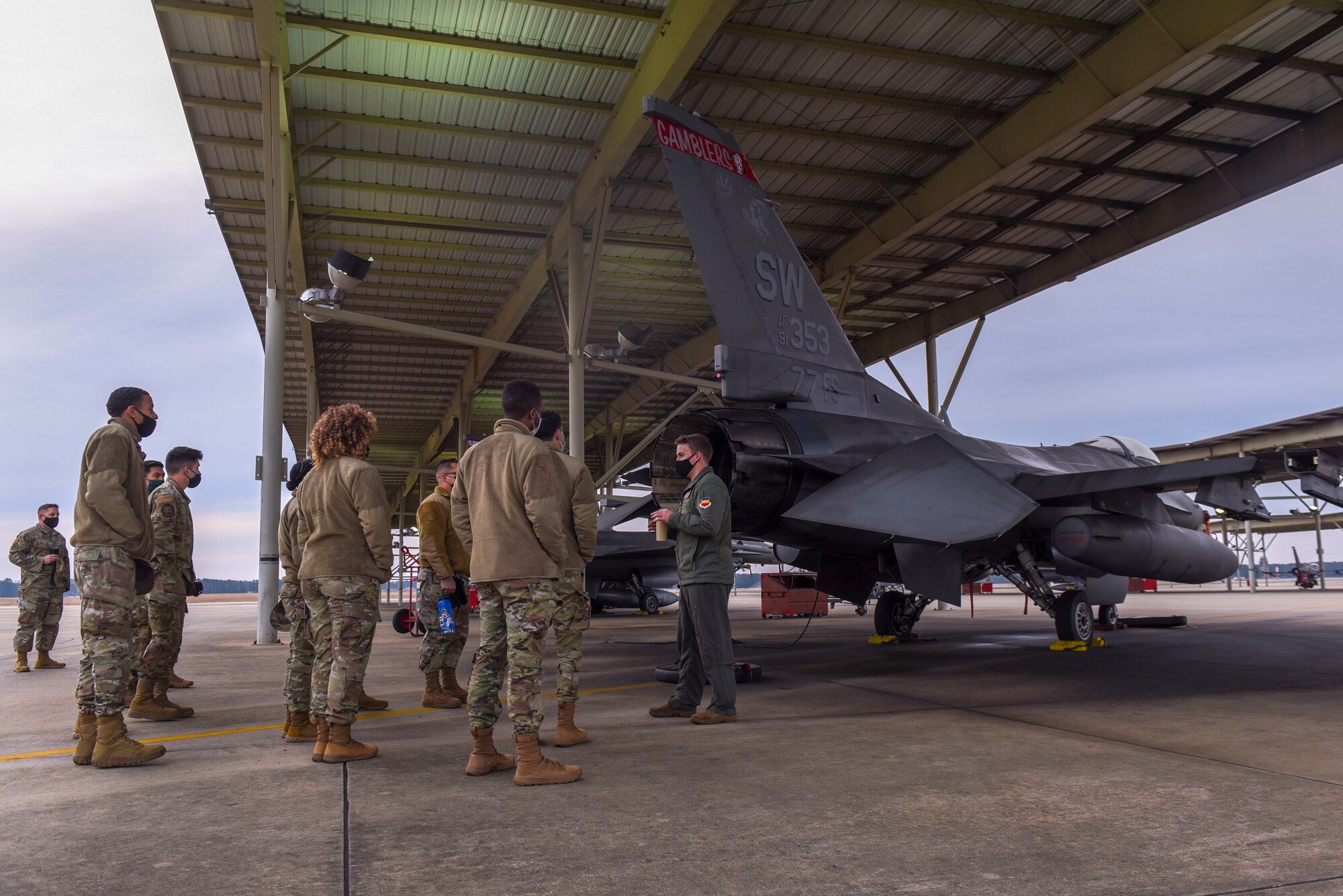 Airmen take a tour of the 77th Fighter Squadron.