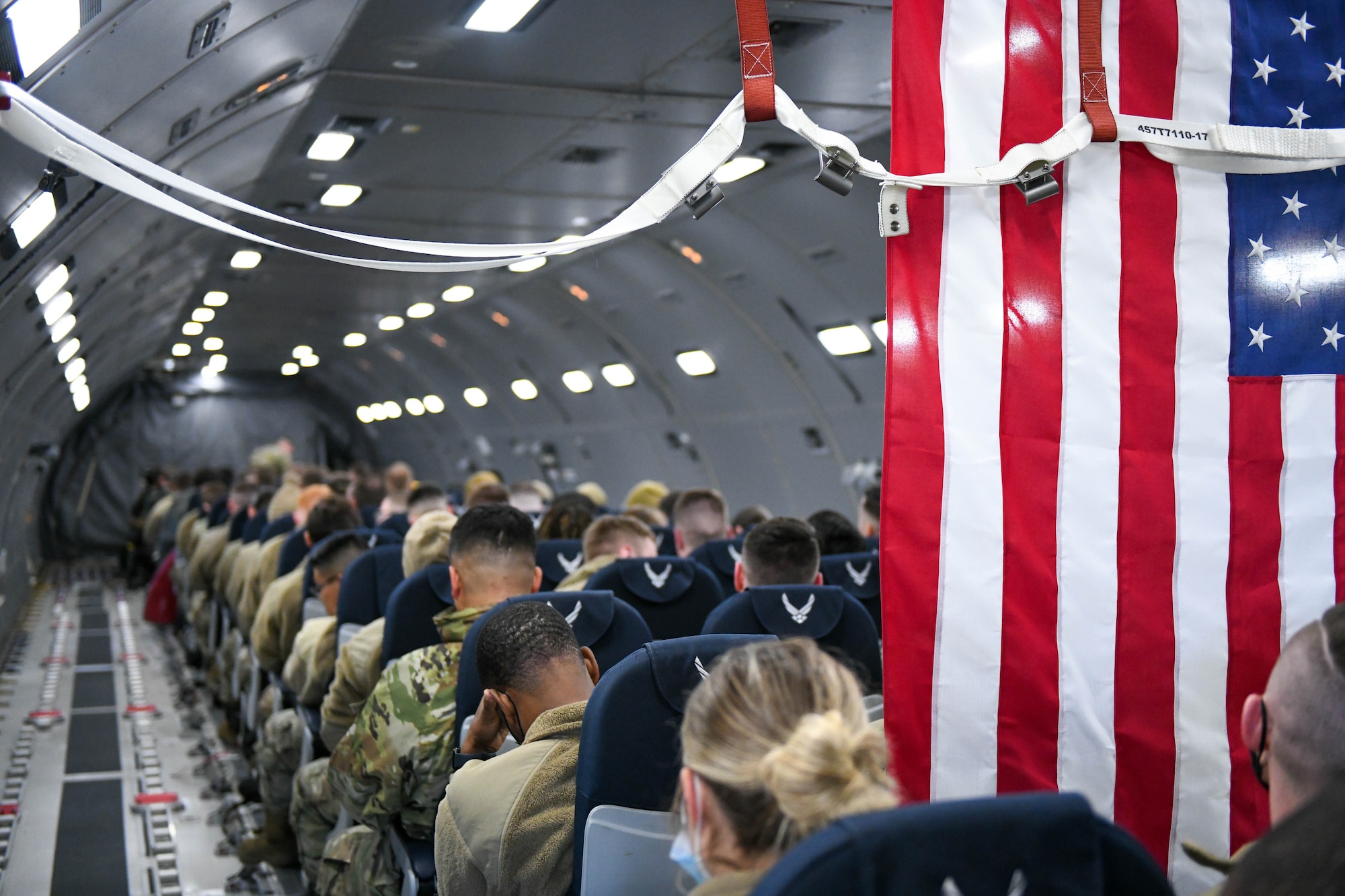 Airmen from the 56th Operations Group (OG) sit on a KC-46 Pegasus on Luke Air Force Base, Arizona, Jan. 28, 2022. Made up of seven fighter squadrons, the 56th OG is the largest fighter group in the United States Air Force. (U.S. Air Force photo by Airman 1st Class Trenton Jancze)