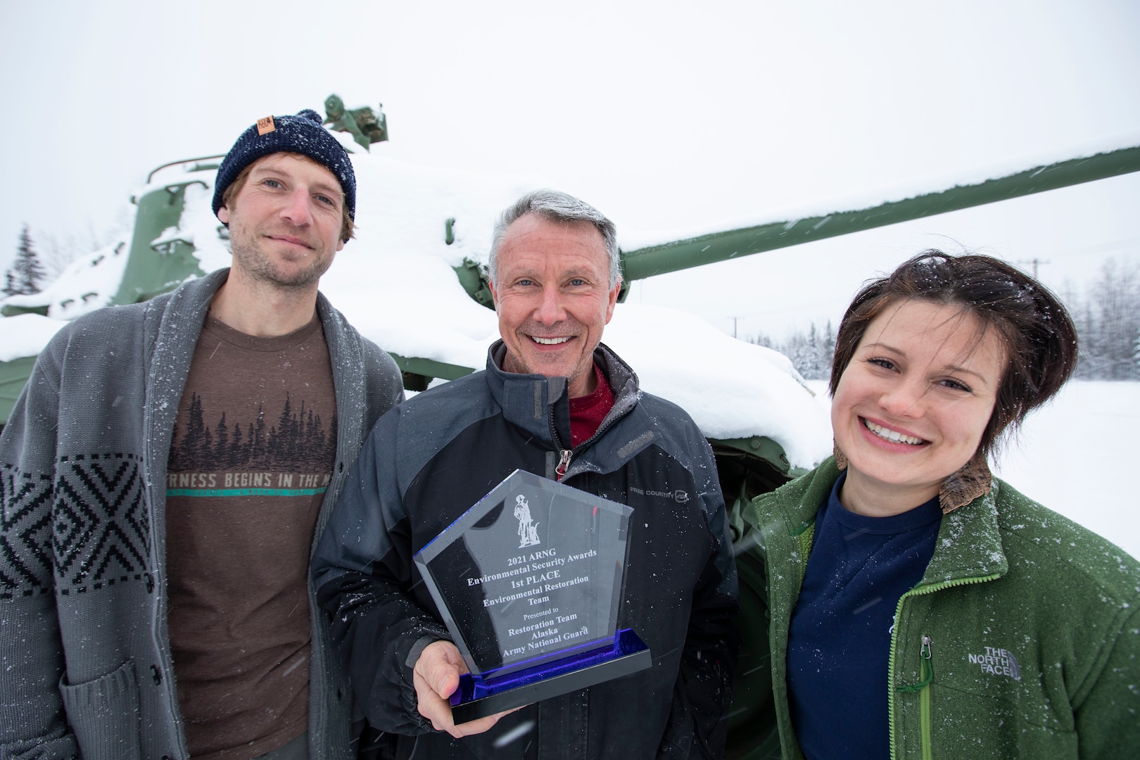 The Alaska Army National Guard's Restoration Team, Patrick Greary (left), Donald Flournoy, Alyssa Murphy and Aaron Acena (not pictured), received the Environmental Security Award from the National Guard Bureau for their accomplishments in environmental restoration for former AKNG properties. (U.S. Army National Guard photo by Victoria Granado)