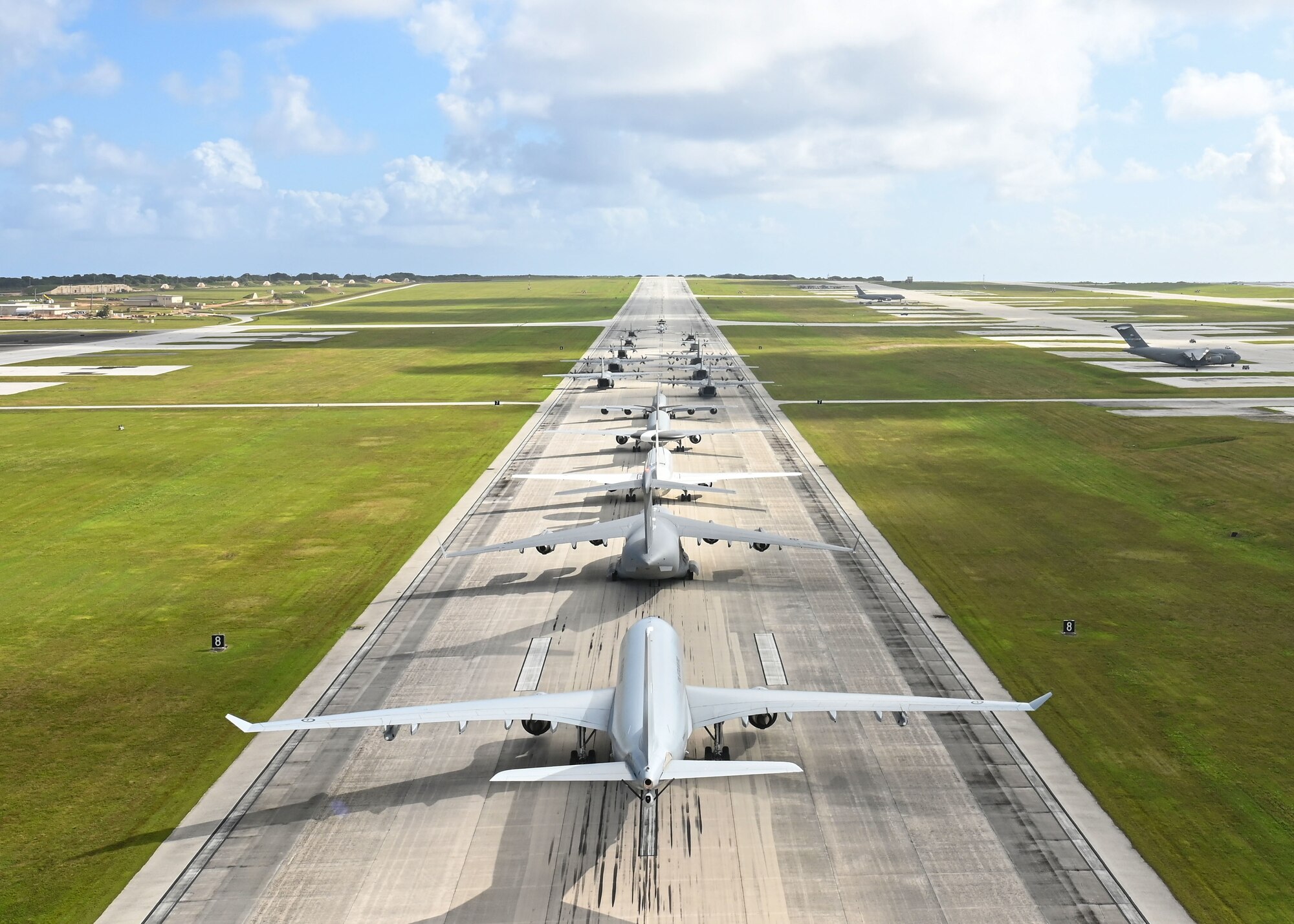 U.S. Air Force, Royal Australian Air Force, Japan Air Self-Defense Force, and regional allies and partners aircraft participate in a close formation taxi, known as an Elephant Walk, during Cope North 2022 at Andersen Air Force Base, Guam, Feb. 5, 2022.