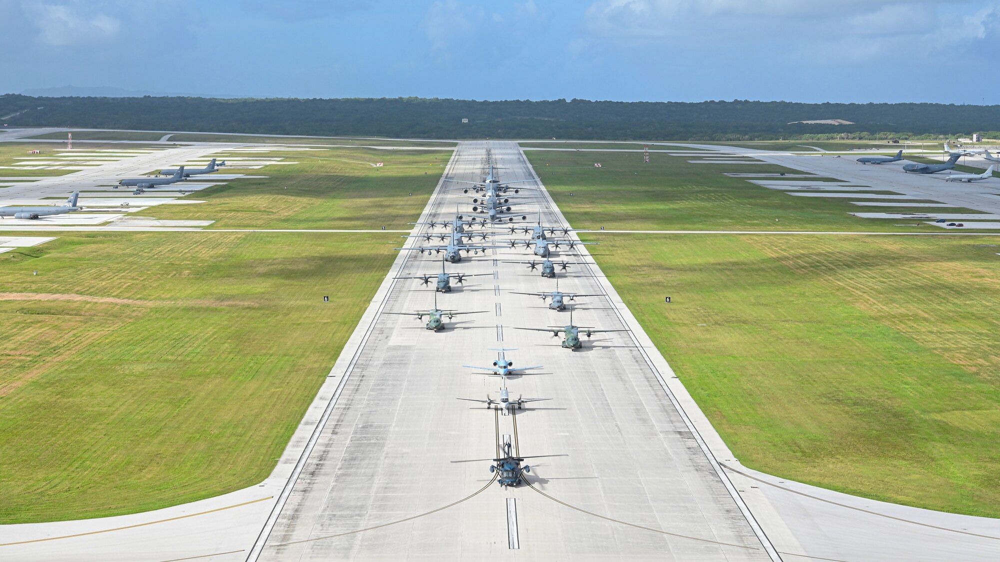 U.S. Air Force, Royal Australian Air Force, Japan Air Self-Defense Force, and regional allies and partners aircraft participate in a close formation taxi, known as an Elephant Walk, during Cope North 2022 at Andersen Air Force Base, Guam, Feb. 5, 2022.