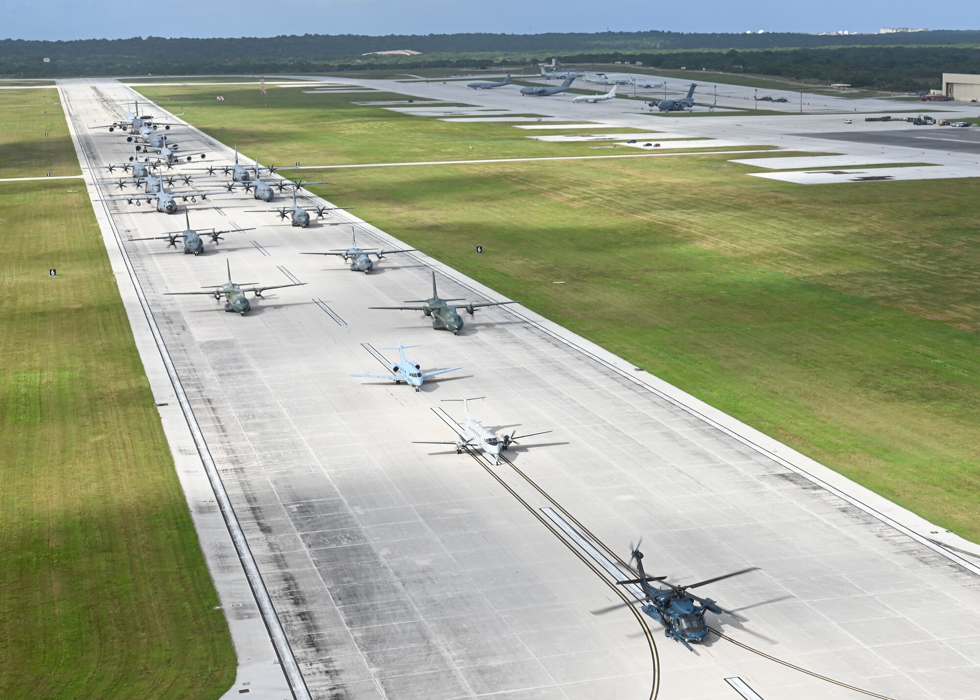 U.S. Air Force, Royal Australian Air Force, Japan Air Self-Defense Force, and regional allies and partners aircraft participate in a close formation taxi, known as an Elephant Walk, during Cope North 2022 at Andersen Air Force Base, Guam, Feb. 5, 2022.