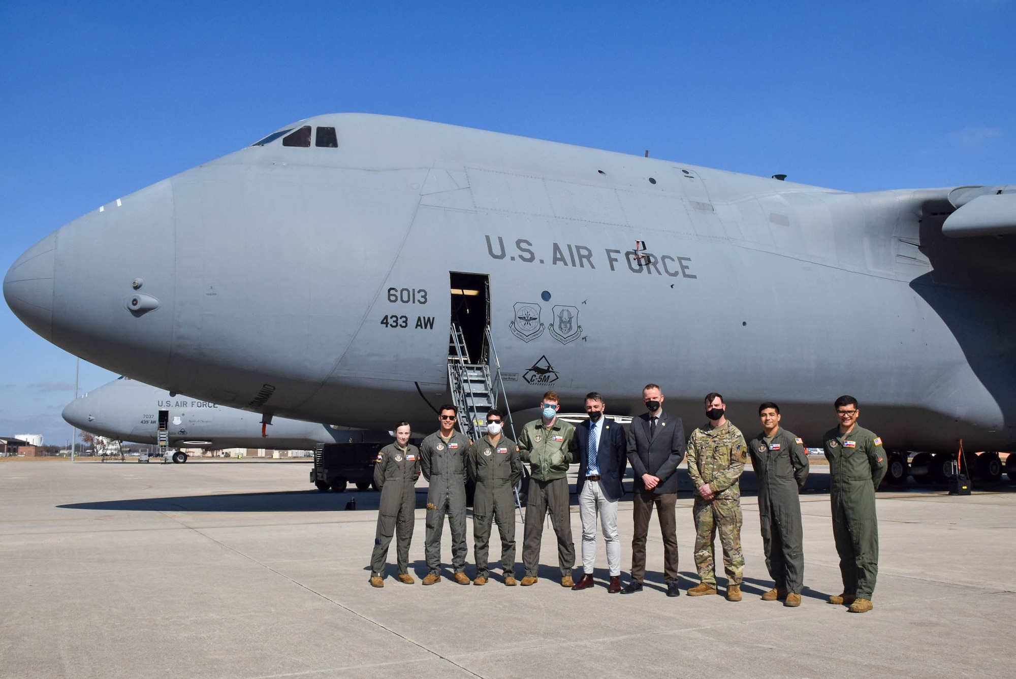 Reserve Citizen Airmen in the 68th Airlift Squadron and two Jagello 2000 Association representatives stand in front of a C-5M Super Galaxy at Joint Base San Antonio-Lackland, Texas, Jan. 25, 2022. The Jagello 2000 Association representatives witnessed first-hand the 433rd Airlift Wing mission-sets and world-wide operational capabilities. (U.S. Air Force photo by Airman Mark Colmenares)