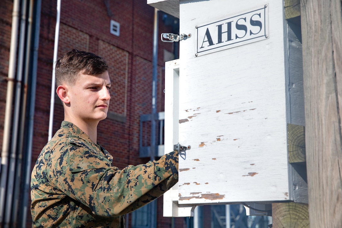 U.S. Marine Corps Cpl. Haydon R. King, a meteorology and oceanography analyst (METOC) forecaster with Marine Corps Air Facilities Quantico, checks the automated heat stress system at Marine Corps Base Quantico, Virginia, Jan. 26, 2022. This device reads and analyzes all factors regarding the heat index, which allows the Marines to determine and pass on the flag conditions, from green to black, and notify the base commander about what activities can be conducted during the given conditions. (US Marine Corps photo by Lance Cpl. Kayla LaMar)