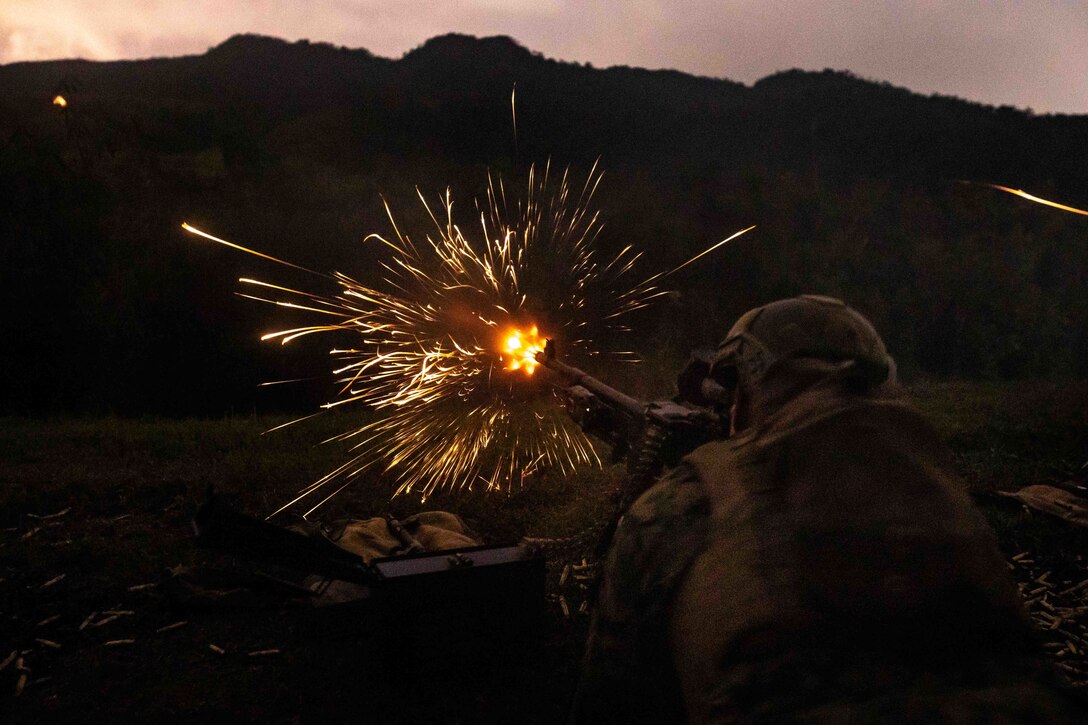 A U.S. Marine with 1st Battalion, 3d Marines, 3d Marine Division, fires an M240B machine gun during a live-fire range on Okinawa, Japan, Feb. 2, 2022. 1/3 executed a crew served weapons and rocket sustainment range to maintain readiness for expeditionary operations in contested environments. 1/3 is forward-deployed in the Indo-Pacific under 4th Marines as a part of the Unit Deployment Program. (U.S. Marine Corps photo by Sgt. Micha Pierce)