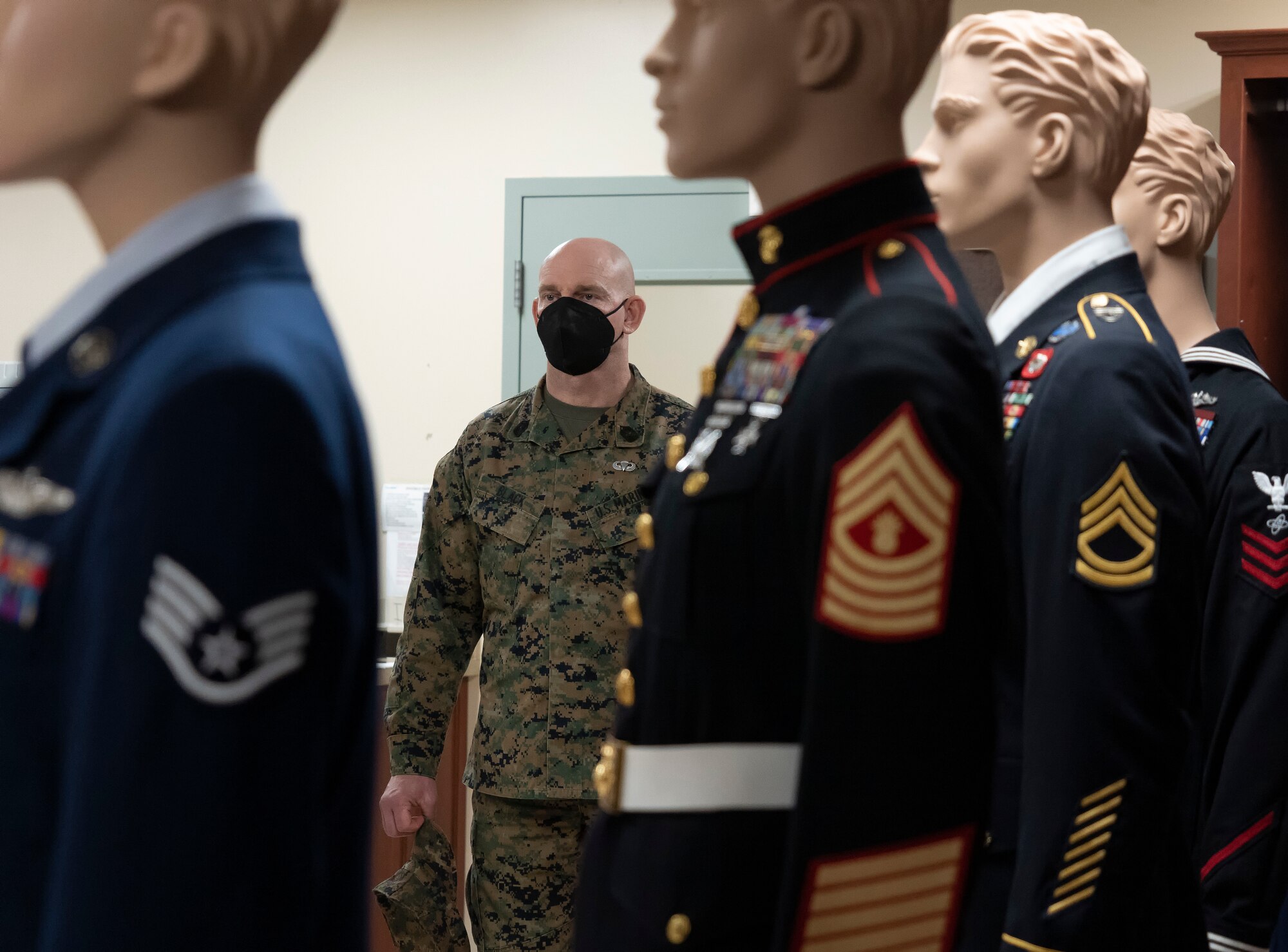 Sergeant Major of the Marine Corps Troy Black visits the uniform section of Air Force Mortuary Affairs Operations, Dover Air Force Base, Delaware, Feb. 8, 2022. AFMAO’s uniform section contains uniforms and accouterments for all branches of service in the Department of Defense. (U.S. Air Force photo by Jason Minto)