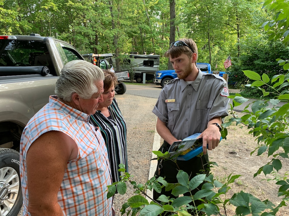 Park ranger talks with park guests